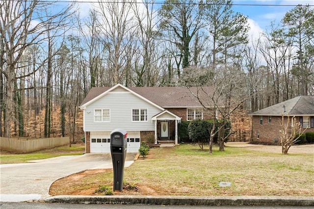 view of front of house featuring a garage and a front lawn