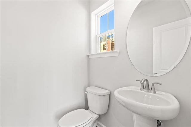 bathroom with sink and toilet