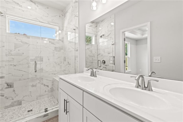 bathroom with walk in shower and vanity