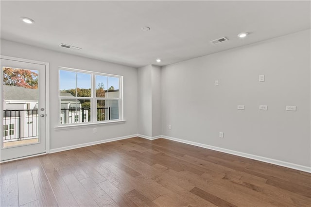 spare room featuring hardwood / wood-style floors