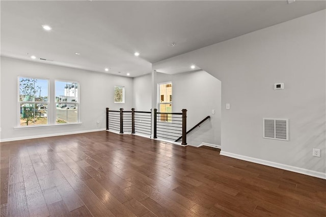 spare room with dark hardwood / wood-style flooring