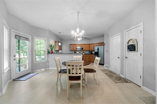 dining space featuring a chandelier