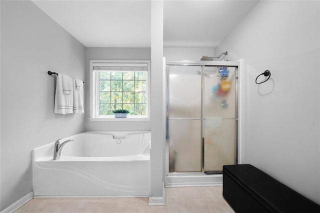 bathroom featuring shower with separate bathtub and tile patterned flooring