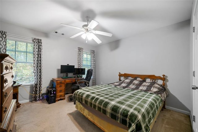 bedroom with ceiling fan and carpet floors