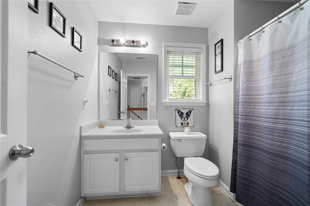 bathroom featuring walk in shower, vanity, hardwood / wood-style flooring, and toilet