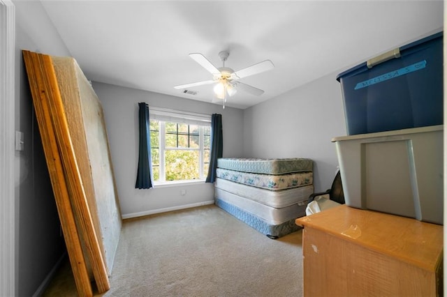 unfurnished bedroom with light colored carpet and ceiling fan