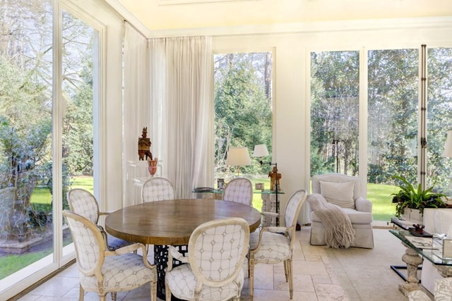 sunroom / solarium featuring plenty of natural light