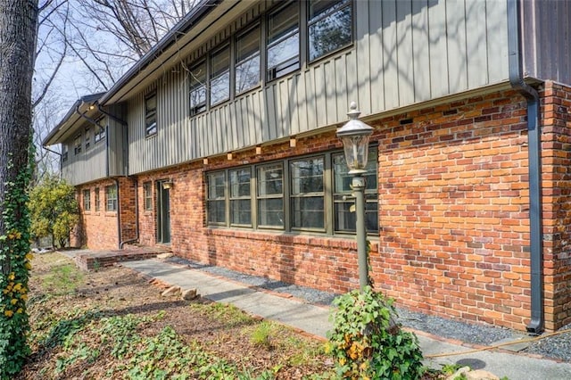 exterior space with brick siding