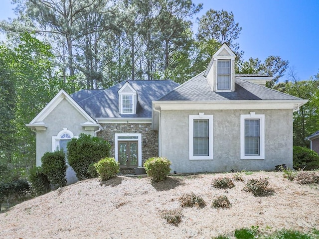 1017 Fairway Valley Dr, Woodstock, GA 30189 - new england style home featuring stone siding, a shingled roof, french doors, and stucco siding