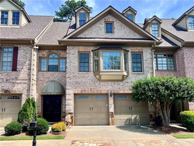 multi unit property featuring a garage