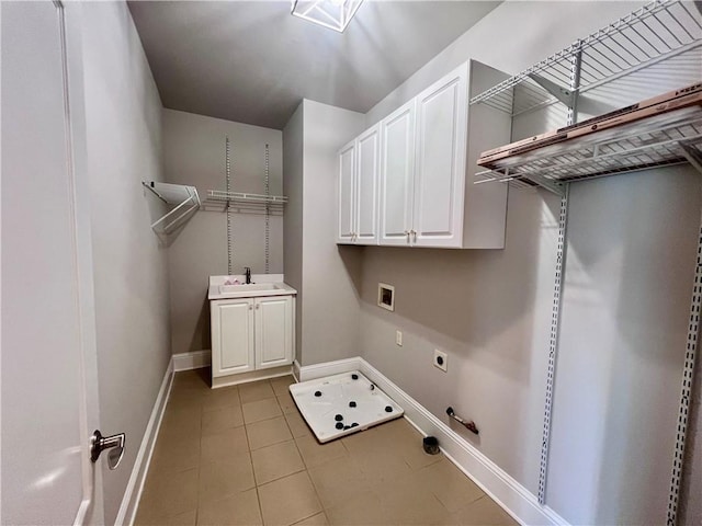 clothes washing area with sink, gas dryer hookup, cabinets, washer hookup, and hookup for an electric dryer