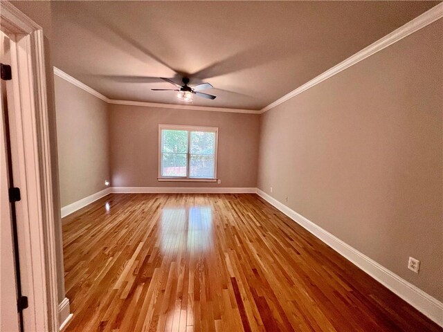 unfurnished room featuring crown molding, ceiling fan, and light hardwood / wood-style floors