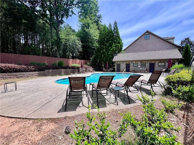 view of pool featuring a patio