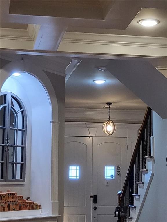 entrance foyer featuring crown molding