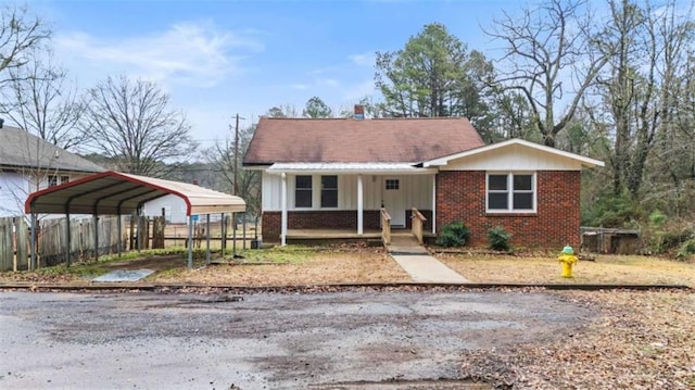 view of front of house featuring a carport and a porch