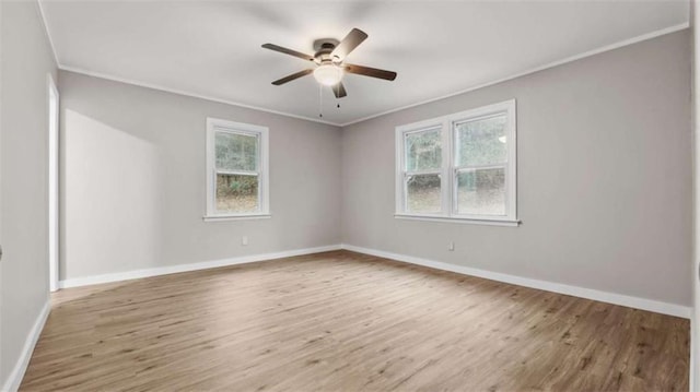 spare room with crown molding, ceiling fan, and light hardwood / wood-style floors