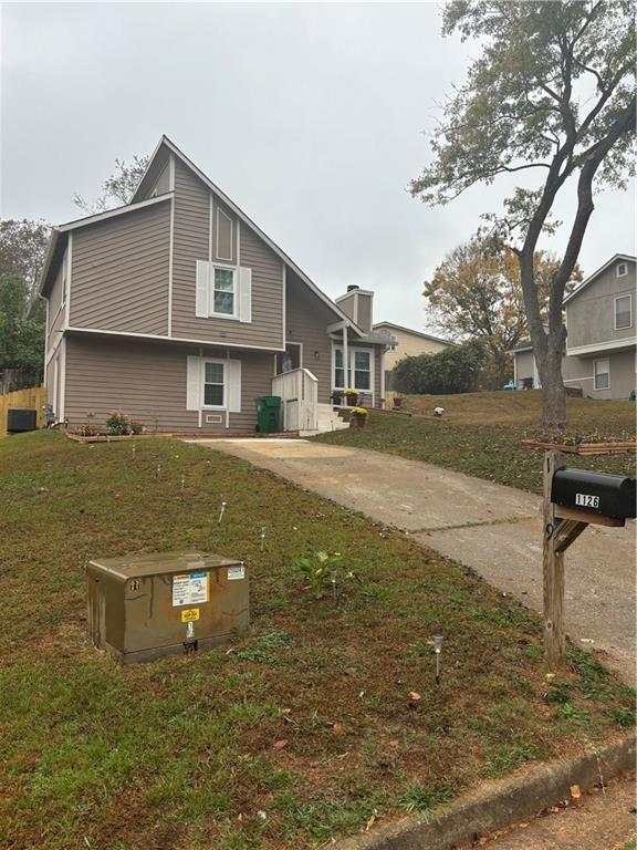 exterior space with a front yard