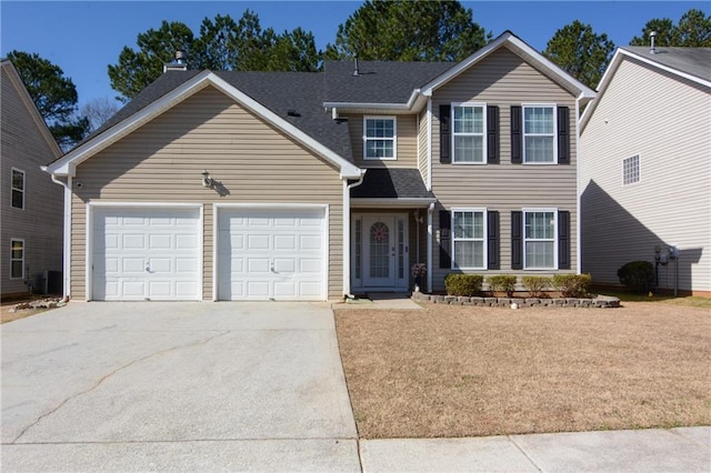 view of front of house featuring concrete driveway, an attached garage, cooling unit, and roof with shingles