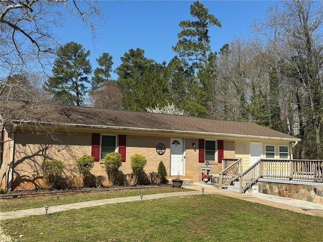 ranch-style home featuring brick siding, a porch, and a front lawn