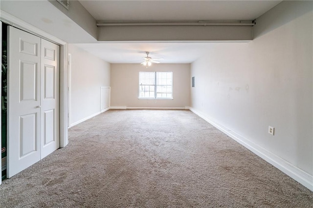 carpeted empty room with ceiling fan