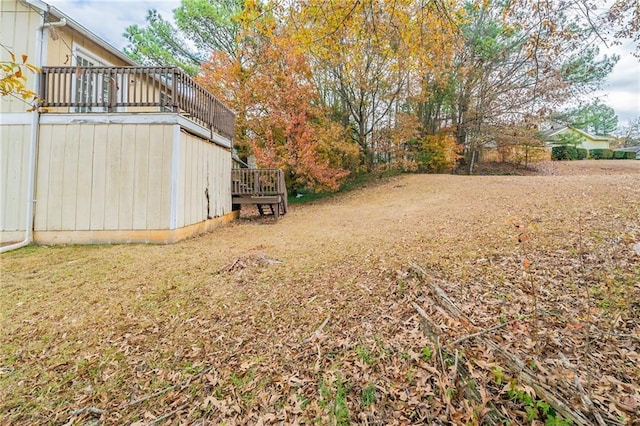 view of yard with a wooden deck