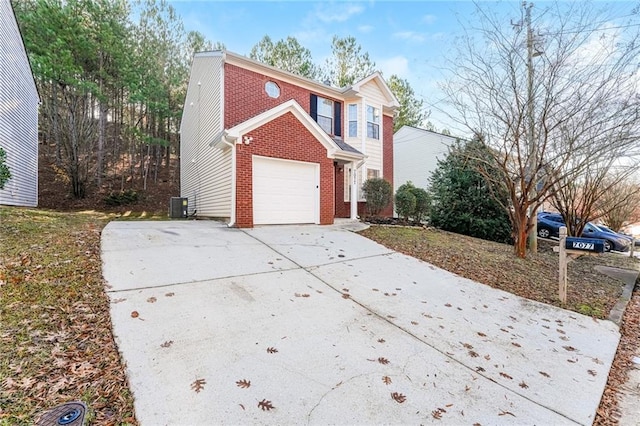 view of side of home with a garage and central AC unit