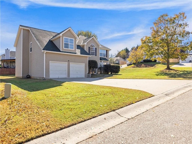 view of front property featuring a garage and a front lawn