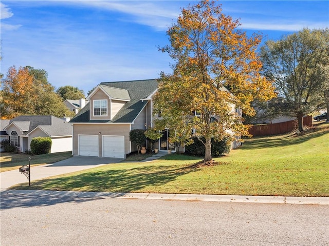 view of front facade featuring a front yard and a garage