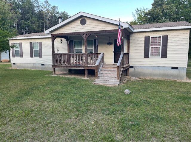 1167 Underwood Rd, Sparta, GA 31087 - manufactured / mobile home with crawl space, covered porch, and a front yard