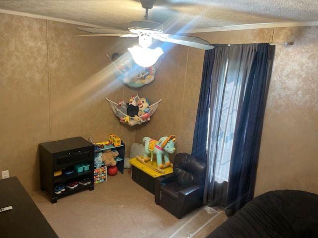 1167 Underwood Rd, Sparta, GA 31087 - carpeted bedroom with a textured ceiling and ceiling fan