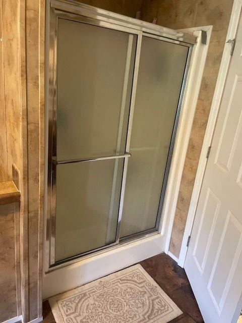 1167 Underwood Rd, Sparta, GA 31087 - bathroom featuring a stall shower
