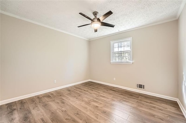 840 Wells Cir SE, Smyrna, GA 30080 - spare room with wood finished floors, ceiling fan, crown molding, a textured ceiling, and baseboards