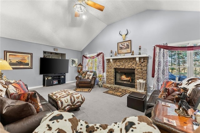 305 Mountain Brook Rd, Dawsonville, GA 30534 - living area with a textured ceiling, a stone fireplace, carpet flooring, ceiling fan, and vaulted ceiling