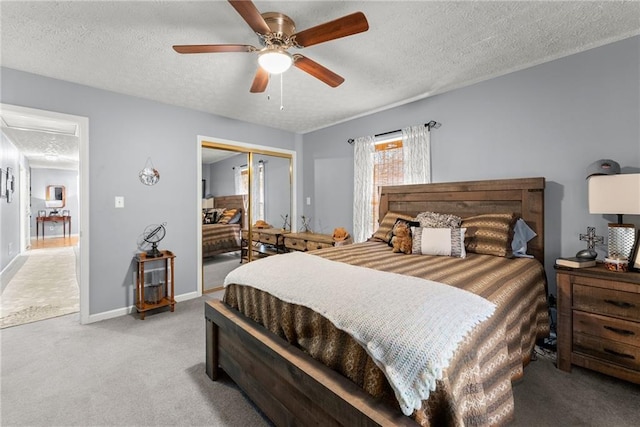 305 Mountain Brook Rd, Dawsonville, GA 30534 - carpeted bedroom featuring a closet, attic access, a textured ceiling, baseboards, and ceiling fan