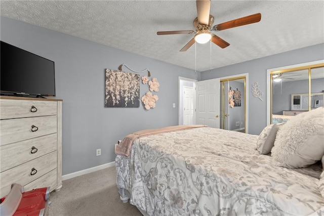 305 Mountain Brook Rd, Dawsonville, GA 30534 - bedroom with a textured ceiling, carpet, baseboards, ceiling fan, and multiple closets