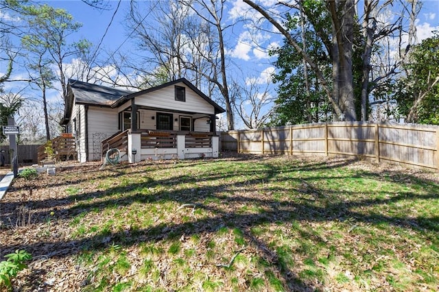 exterior space with a yard and fence private yard