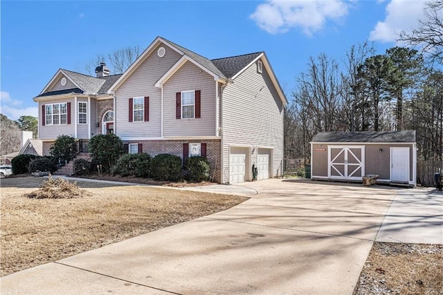 split foyer home with a storage shed and a garage