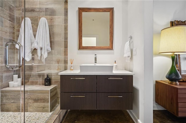 bathroom featuring vanity and an enclosed shower