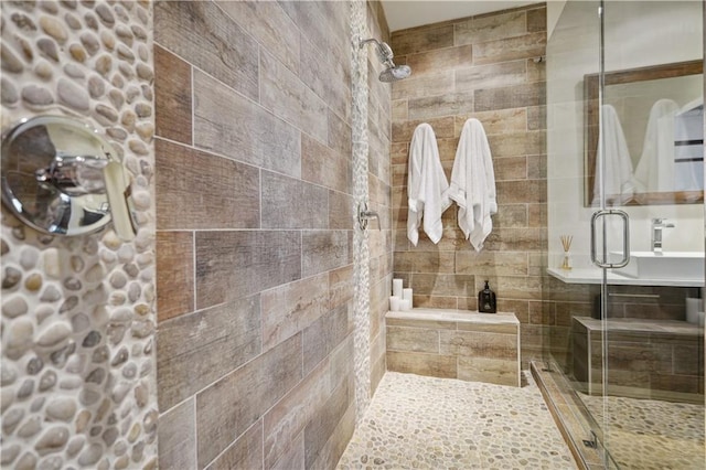 bathroom with a shower with shower door