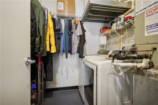 laundry area featuring washing machine and clothes dryer