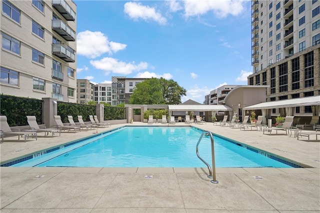 view of swimming pool with a patio area