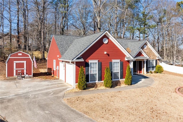 view of front of home with a storage shed