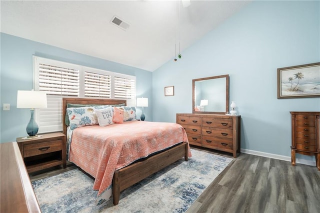 bedroom featuring ceiling fan, dark hardwood / wood-style floors, and high vaulted ceiling