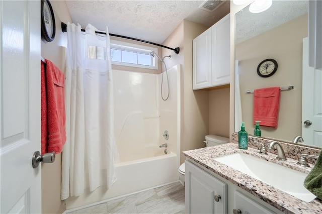 full bathroom featuring shower / tub combo, vanity, toilet, and a textured ceiling