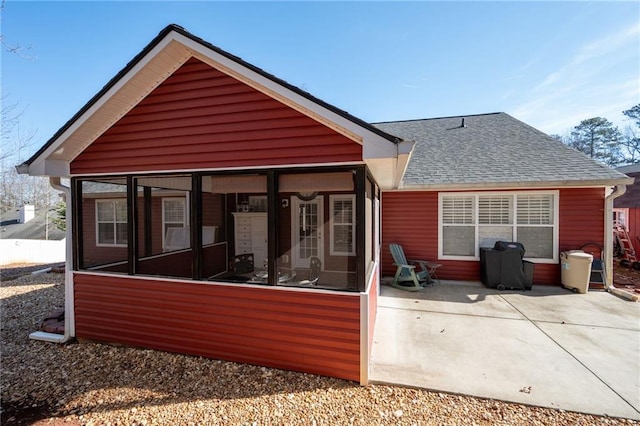 back of property featuring a sunroom