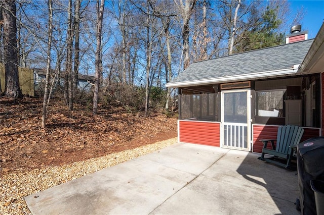 view of patio with a sunroom