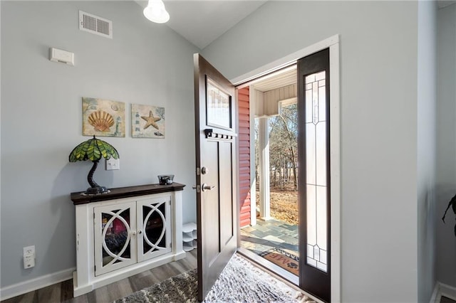 foyer entrance featuring dark hardwood / wood-style flooring