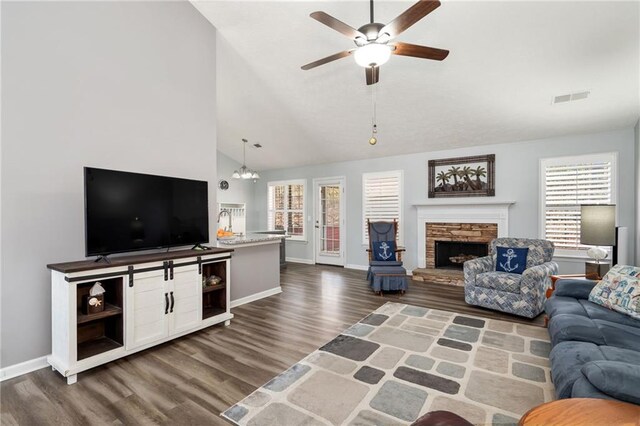 dining area featuring dark hardwood / wood-style flooring, a notable chandelier, and high vaulted ceiling