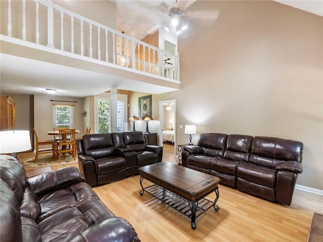 5020 Bayberry Dr, Cumming, GA 30040 - living room featuring ceiling fan, light wood-style floors, and a high ceiling