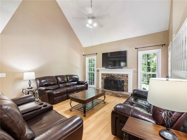 5020 Bayberry Dr, Cumming, GA 30040 - living area with a ceiling fan, wood finished floors, plenty of natural light, a fireplace, and high vaulted ceiling